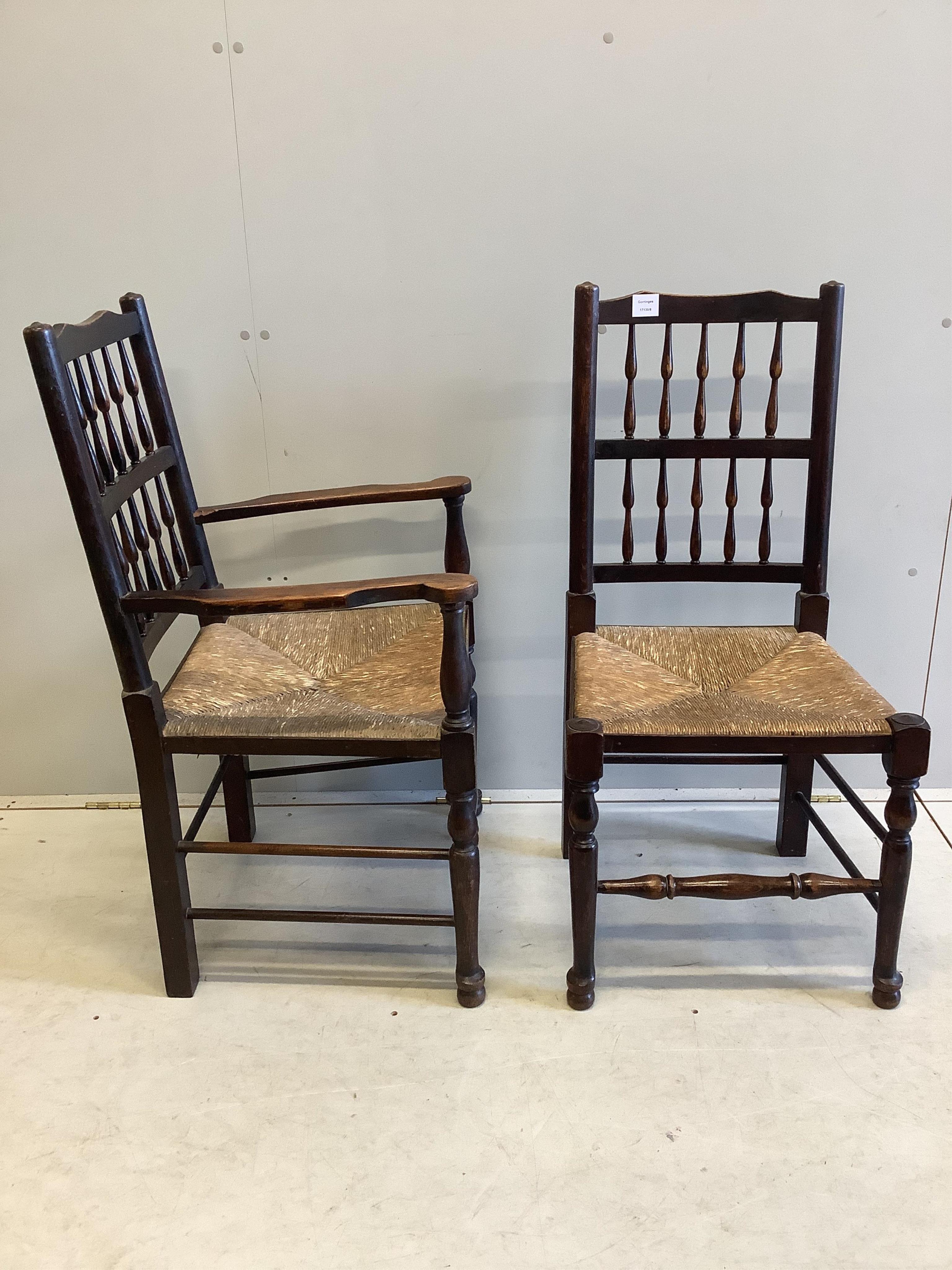 A set of ten ash spindle back chairs, two with arms. Condition - fair